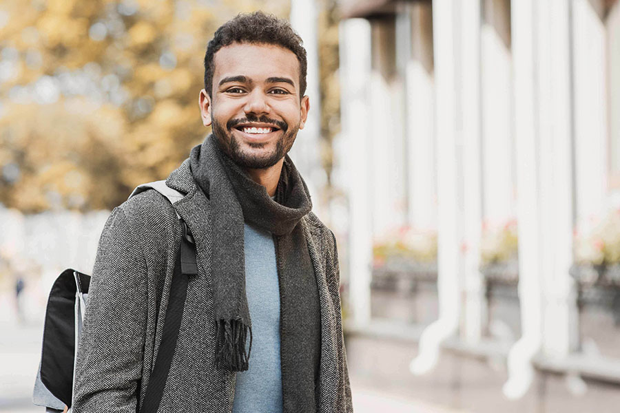 Sober man with a positive outlook smiling