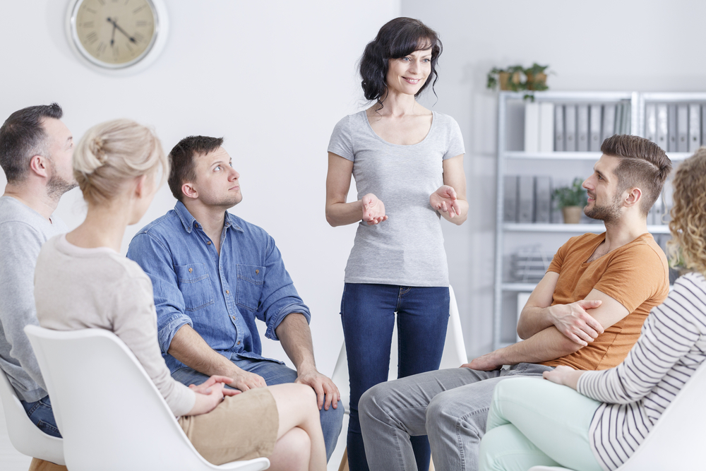 Smiling woman during group therapy