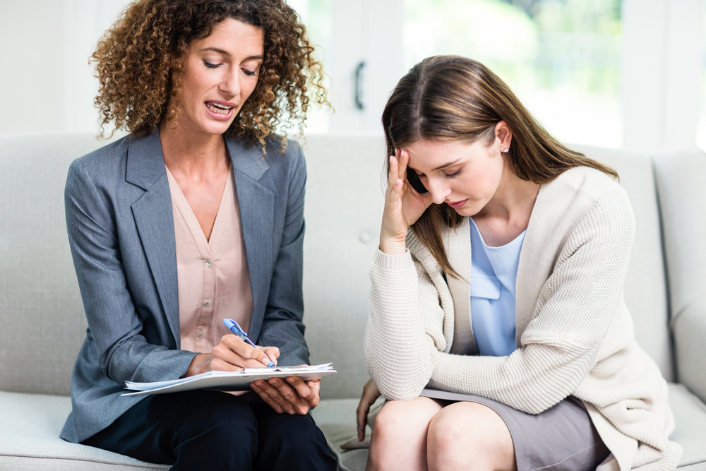 woman having individual therapy session with mental health specialist