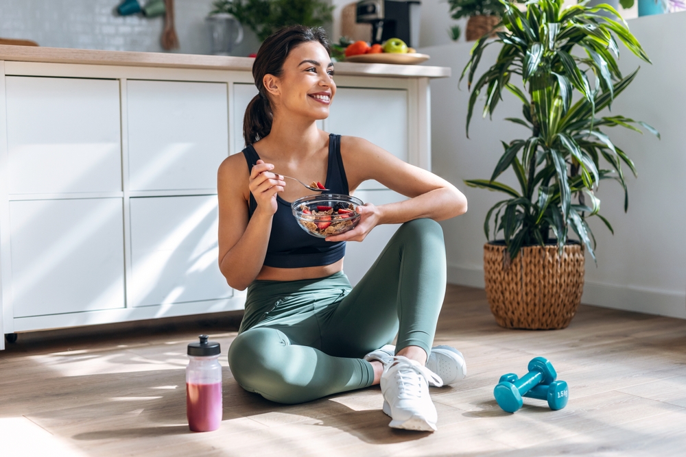 young woman practicing self care by eating healthy and staying active